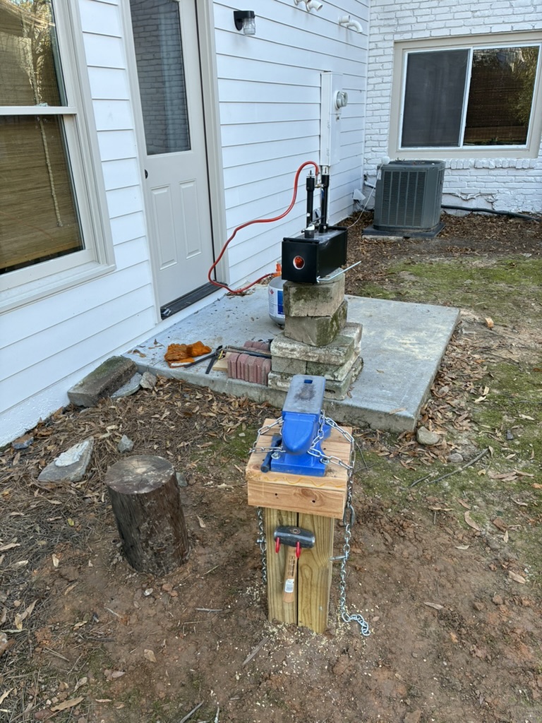 Backyard forge setup with vise and propane forge