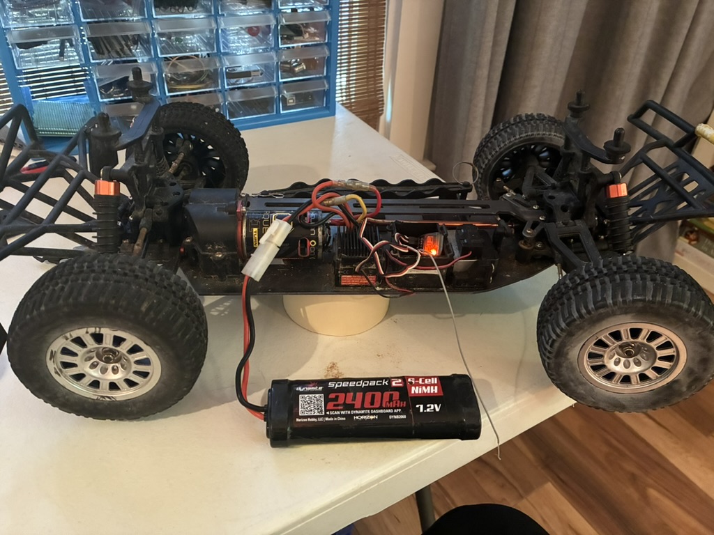 Old RC short course truck with exposed chassis